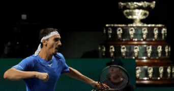 Lorenzo Sonego Davis Cup 2022 celebrates pumping silver bowl