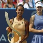 Leylah Fernandez (CAN) and Anna Kalinskaya pose with the championship and finalist trophies, respectively, after their women's singles final of the Mubadala Citi DC Open