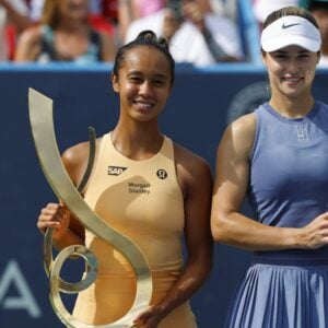 Leylah Fernandez (CAN) and Anna Kalinskaya pose with the championship and finalist trophies, respectively, after their women's singles final of the Mubadala Citi DC Open