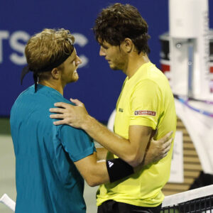 Jul 25, 2025; Washington, D.C., USA; Alejandro Davidovich Fokina (ESP)(L) shakes hands with Taylor Fritz (USA)(R) at the net after their men's singles quarter-final of the Mubadala Citi DC Open at Rock Creek Park Tennis Center. Mandatory Credit: Geoff Burke-Imagn Images/Sipa USA/62962259/sb4/2507260810